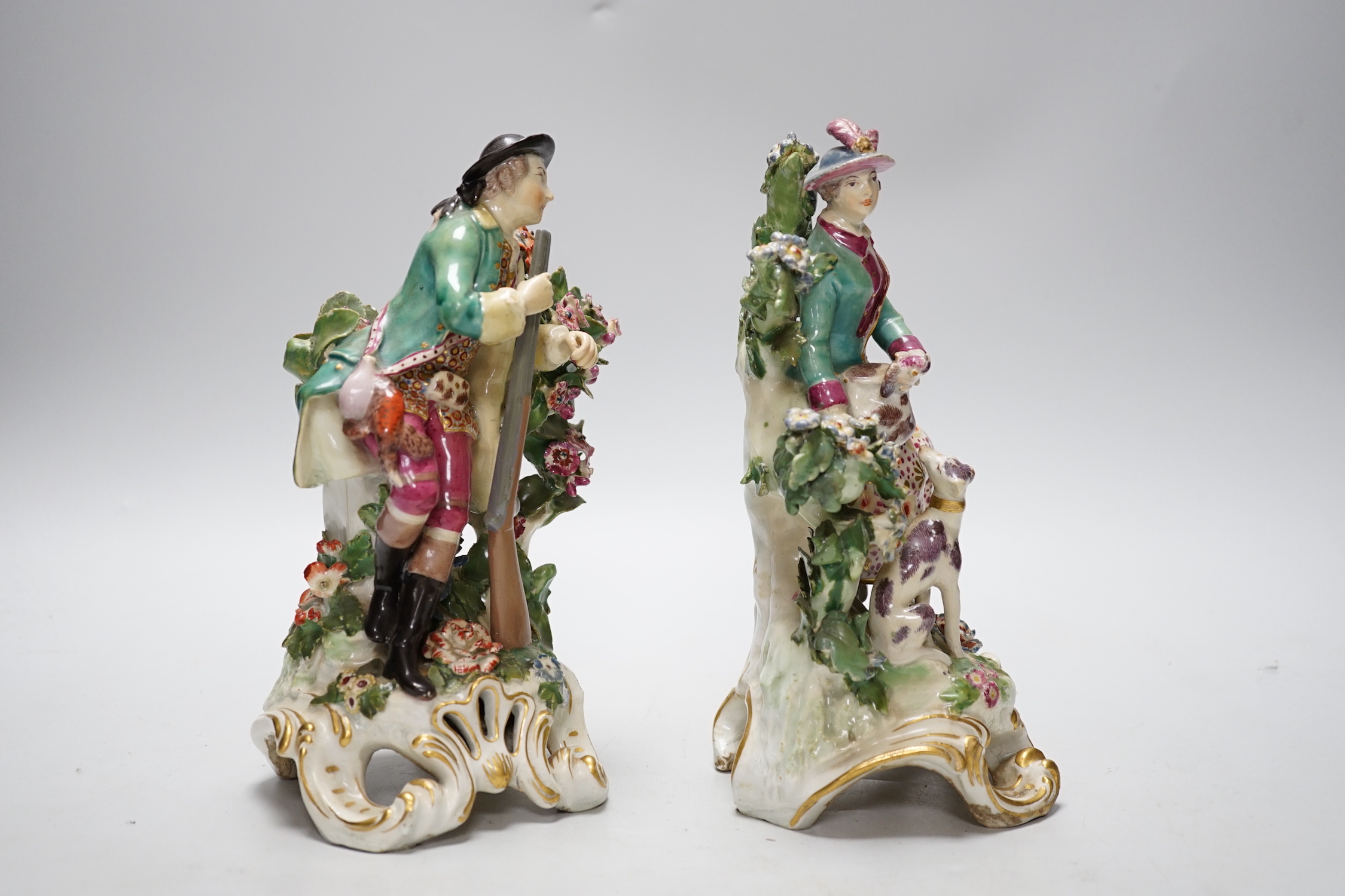 A pair of Chelsea gold anchor period figures wearing 18th century dress, c.1760-65, 22cm